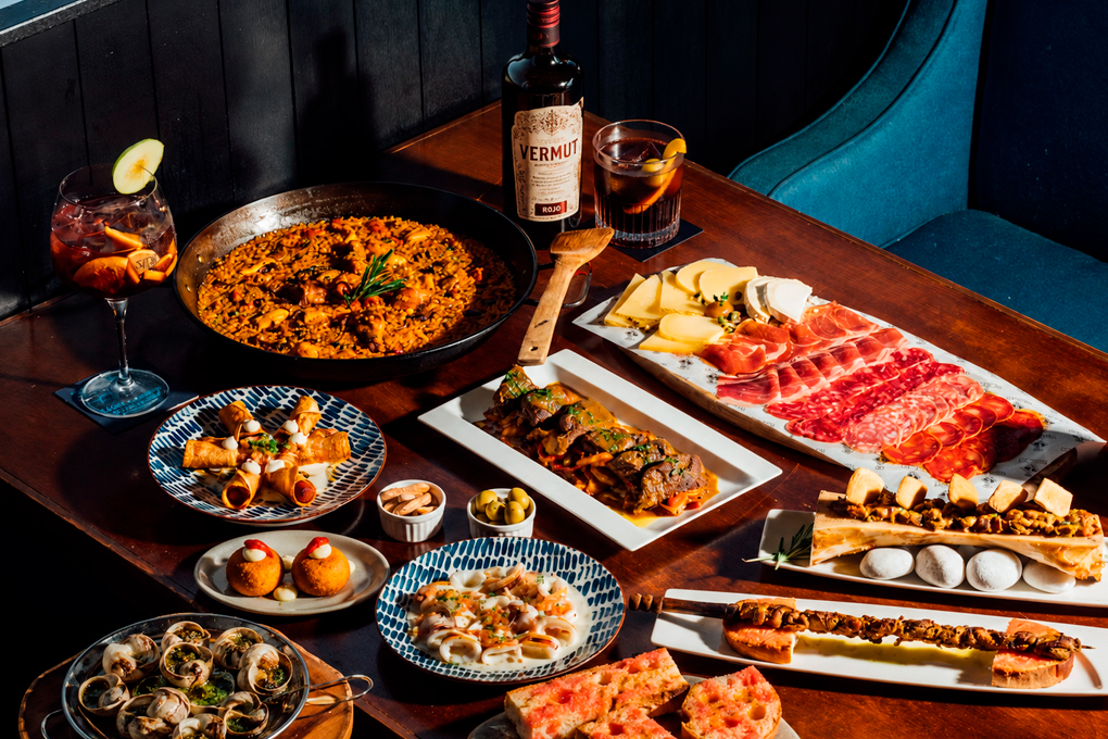 Best tapas in Barcelona: assortment of authentic Catalan tapas with vermouth at a local bar Barcelona
